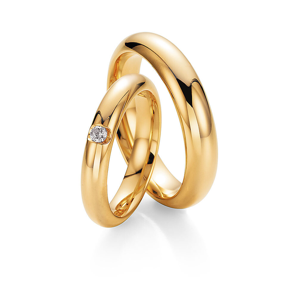 Eheringe Embrace in 18K Gelbgold mit Diamant 0,05ct G/SI